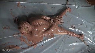 Mud bath for a girl bound in the dungeon