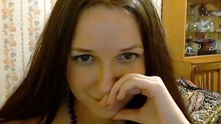 Brunette in stockings stripping and sucking on webcam
